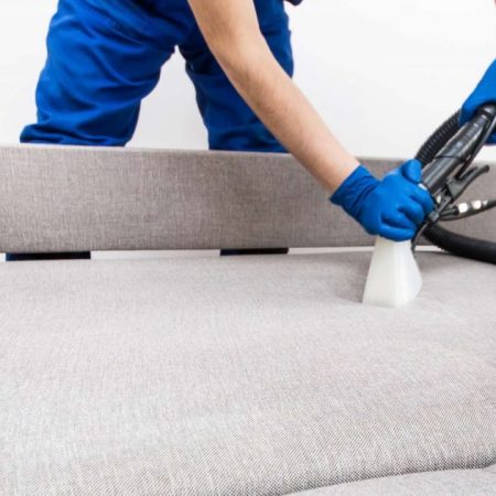 Man Vacuuming Couch